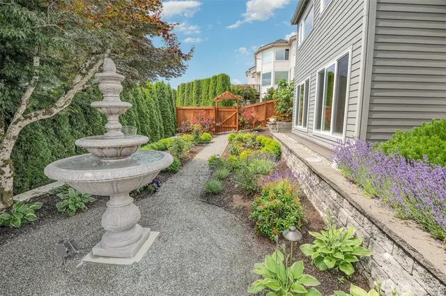 front view of a brick house with a yard