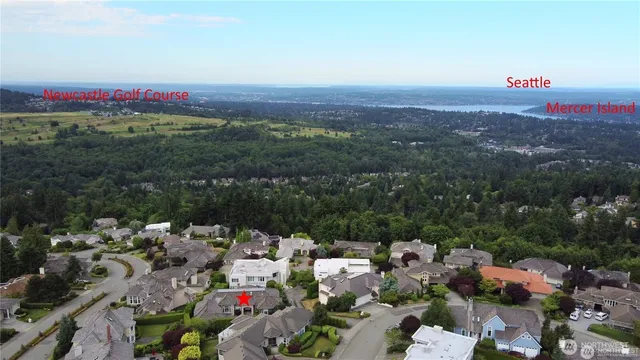 a bathroom with a granite countertop sink mirror and toilet