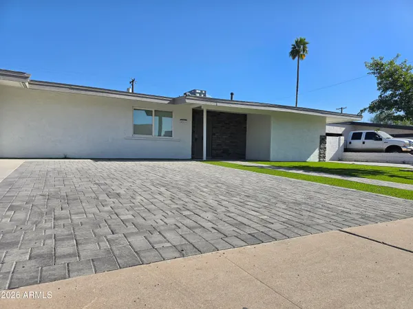 a view of a backyard of the house