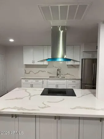 a kitchen with a sink a stove and refrigerator