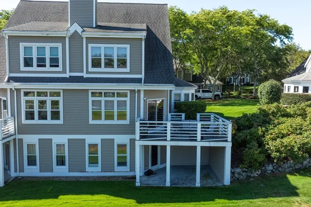 a view of an apartment with a backyard