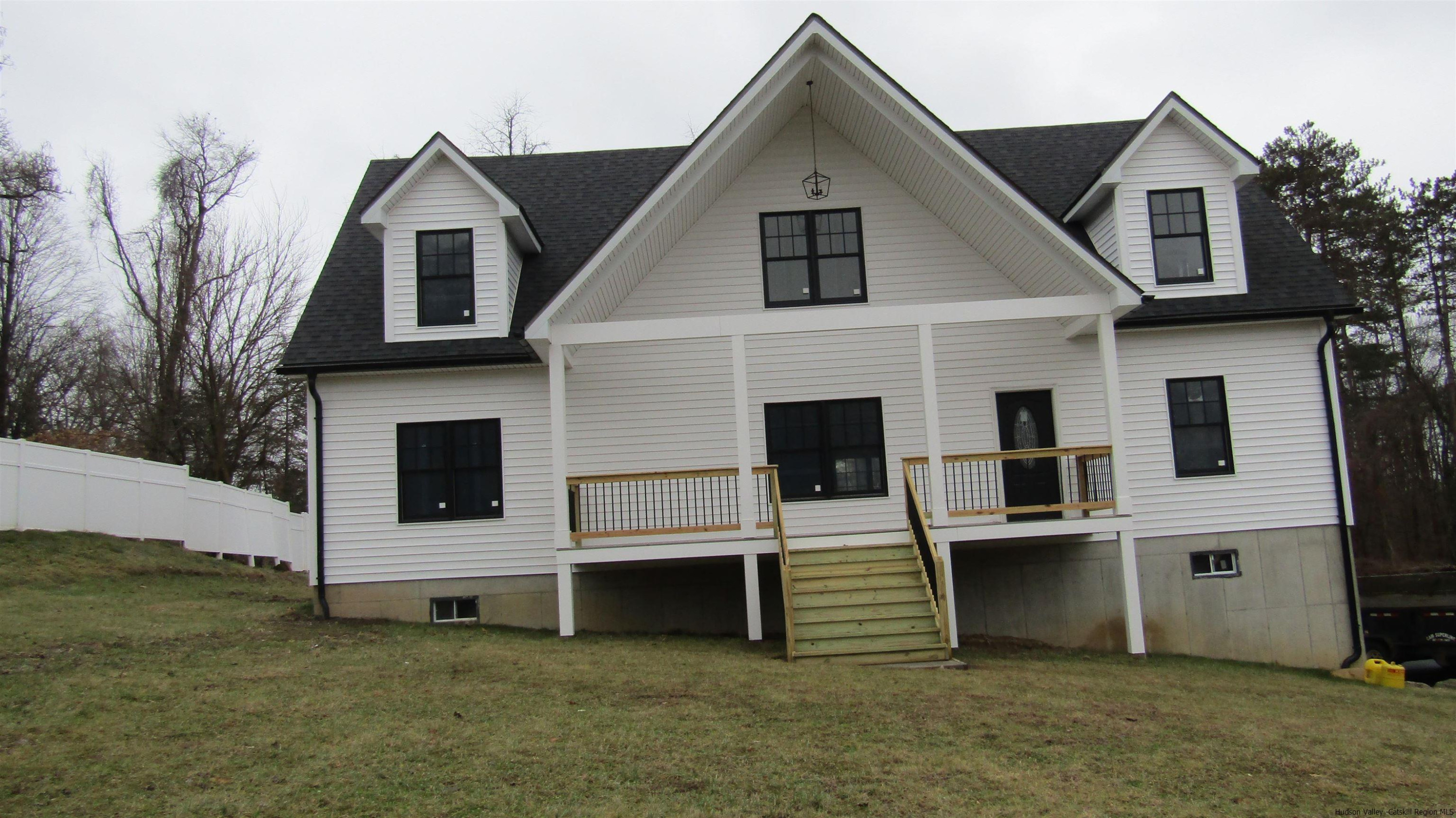51 Duck Pond Road Stone Ridge, NY 12484 - Photo 1 of 31 a front view of a house with a yard