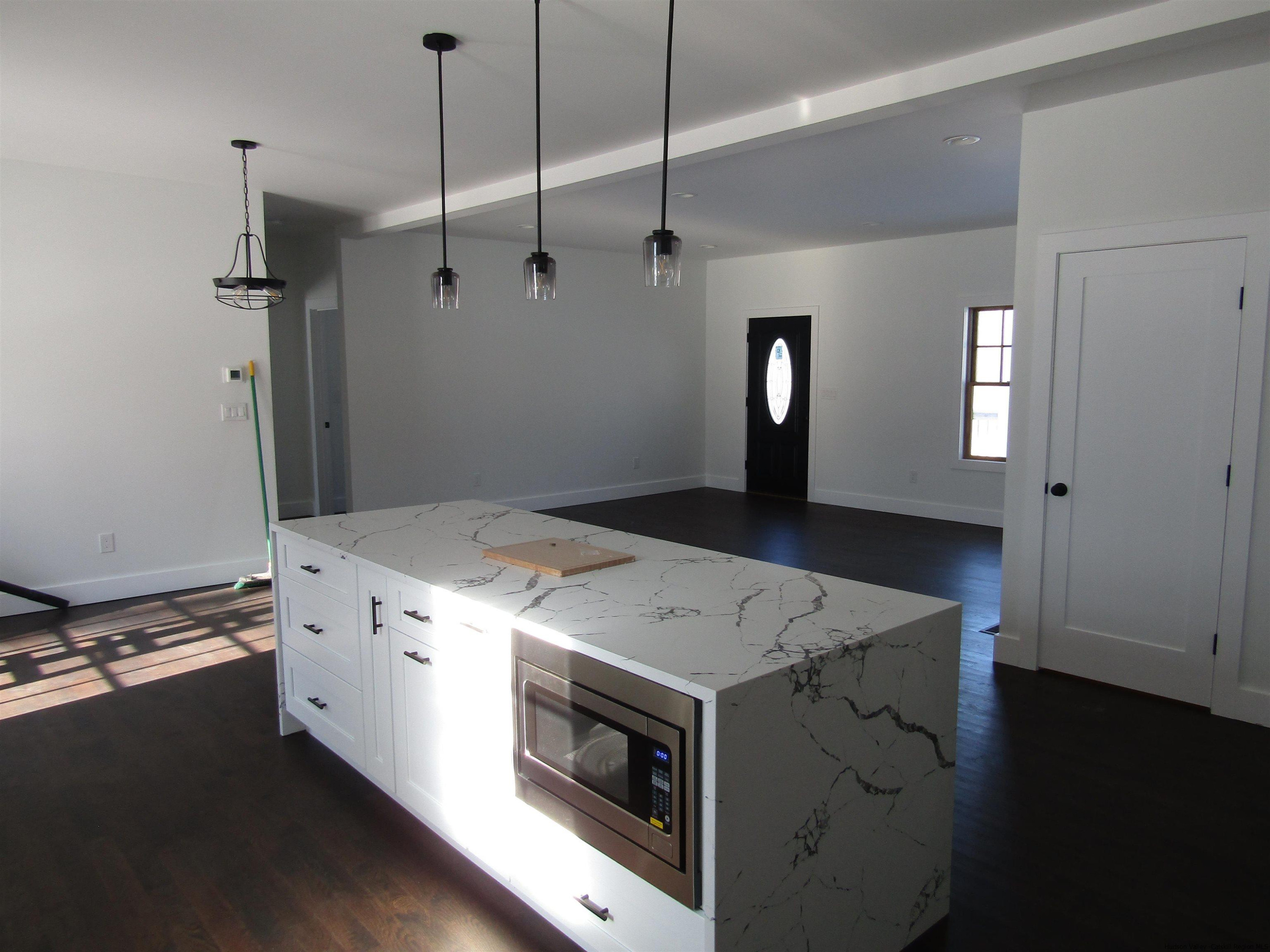 51 Duck Pond Road Stone Ridge, NY 12484 - Photo 11 of 31 a kitchen with a stove and a refrigerator