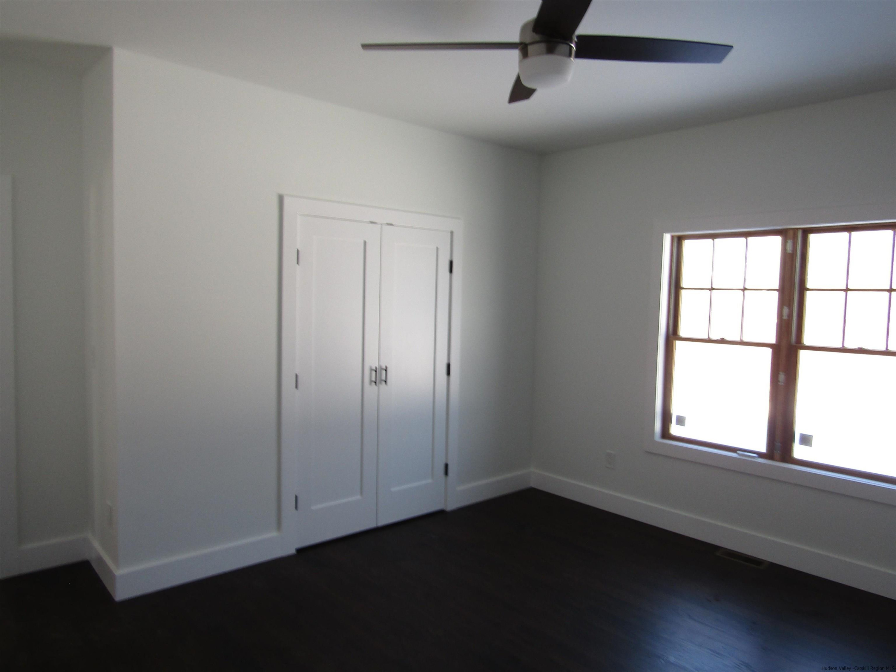51 Duck Pond Road Stone Ridge, NY 12484 - Photo 18 of 31 an empty room with a window