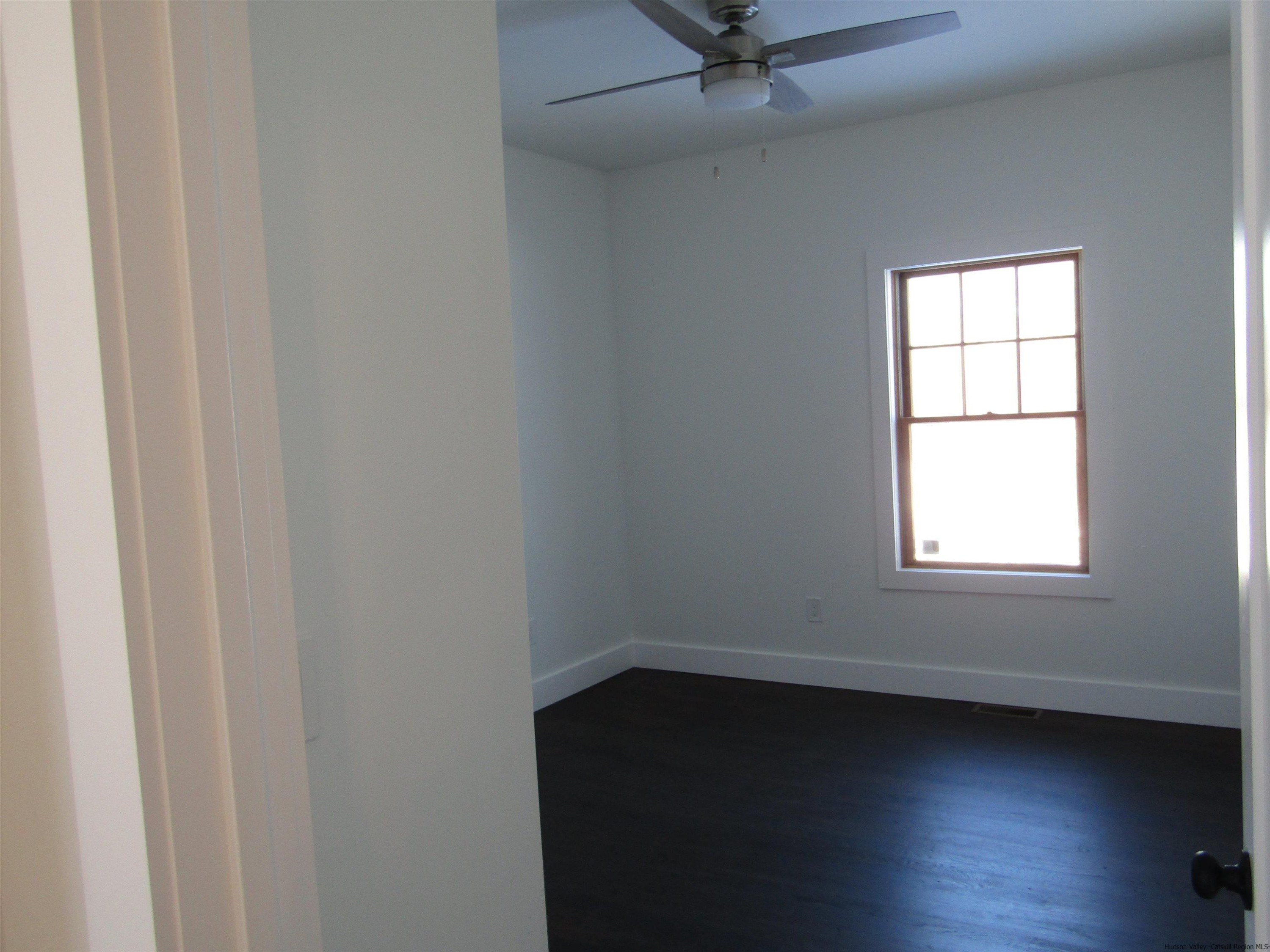 51 Duck Pond Road Stone Ridge, NY 12484 - Photo 23 of 31 an empty room with a window