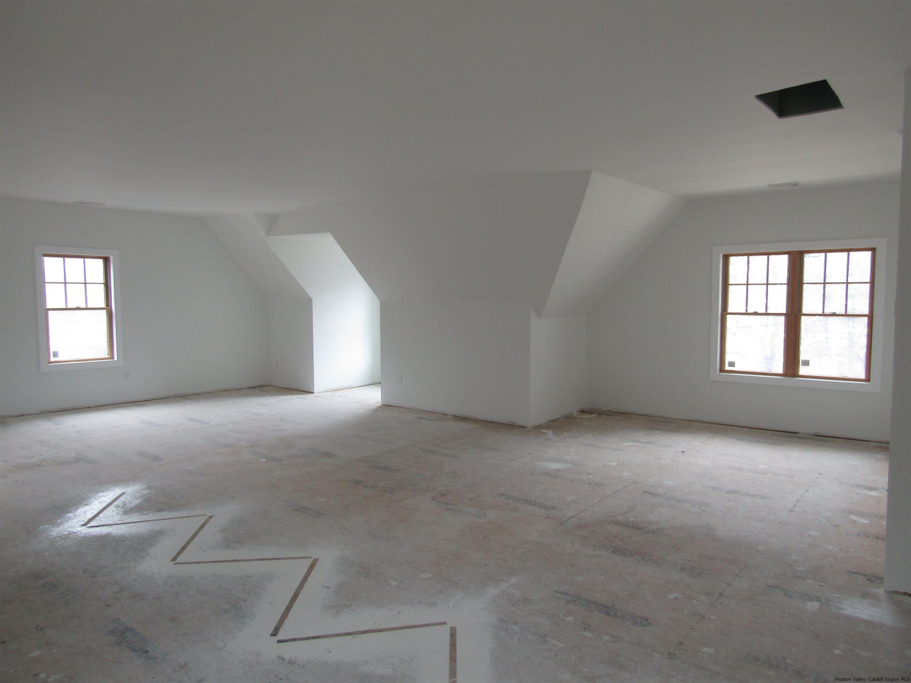 51 Duck Pond Road Stone Ridge, NY 12484 - Photo 27 of 31 a view of empty room with windows