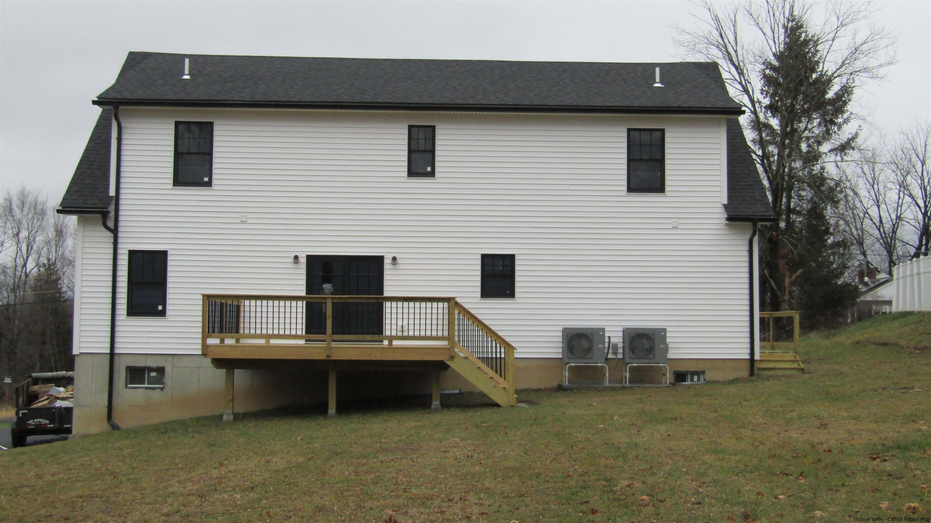 51 Duck Pond Road Stone Ridge, NY 12484 - Photo 5 of 31 a backyard of a house with table and chairs