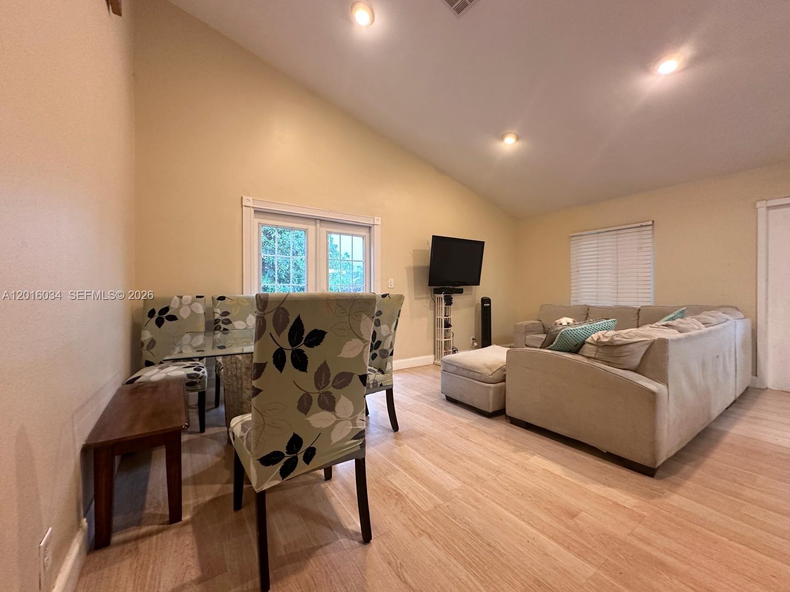 11143 Model Circle East Boca Raton, FL 33428 - Photo 3 of 15 a living room with furniture and a flat screen tv