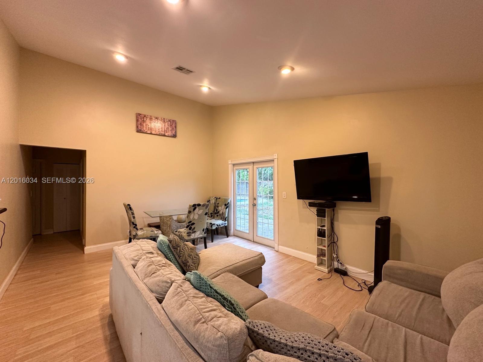 11143 Model Circle East Boca Raton, FL 33428 - Photo 4 of 15 a living room with furniture and a flat screen tv