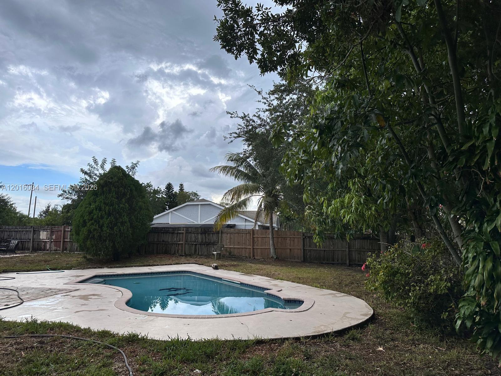 11143 Model Circle East Boca Raton, FL 33428 - Photo 9 of 15 a view of a swimming pool with a yard