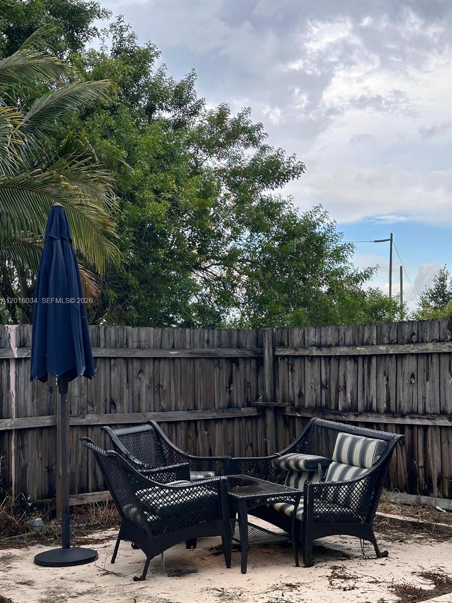 11143 Model Circle East Boca Raton, FL 33428 - Photo 10 of 15 a view of a roof deck with couches and sky view