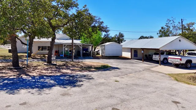 a view of a ocean from a balcony with seating space