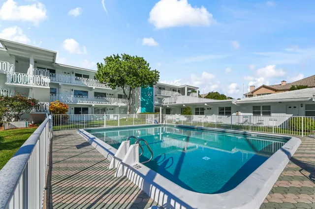 a view of a swimming pool with a patio