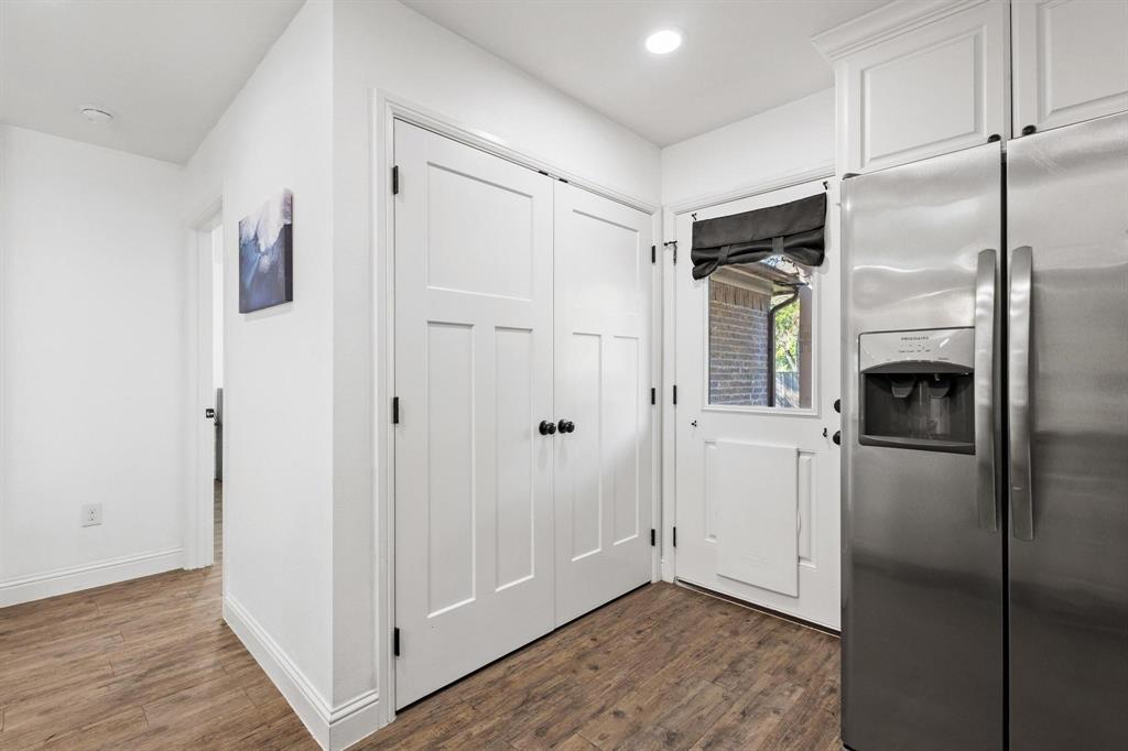 1031 West Gandy Street Denison, TX 75020 - Photo 16 of 33 Doggie Door and Laundry Area in Kitchen