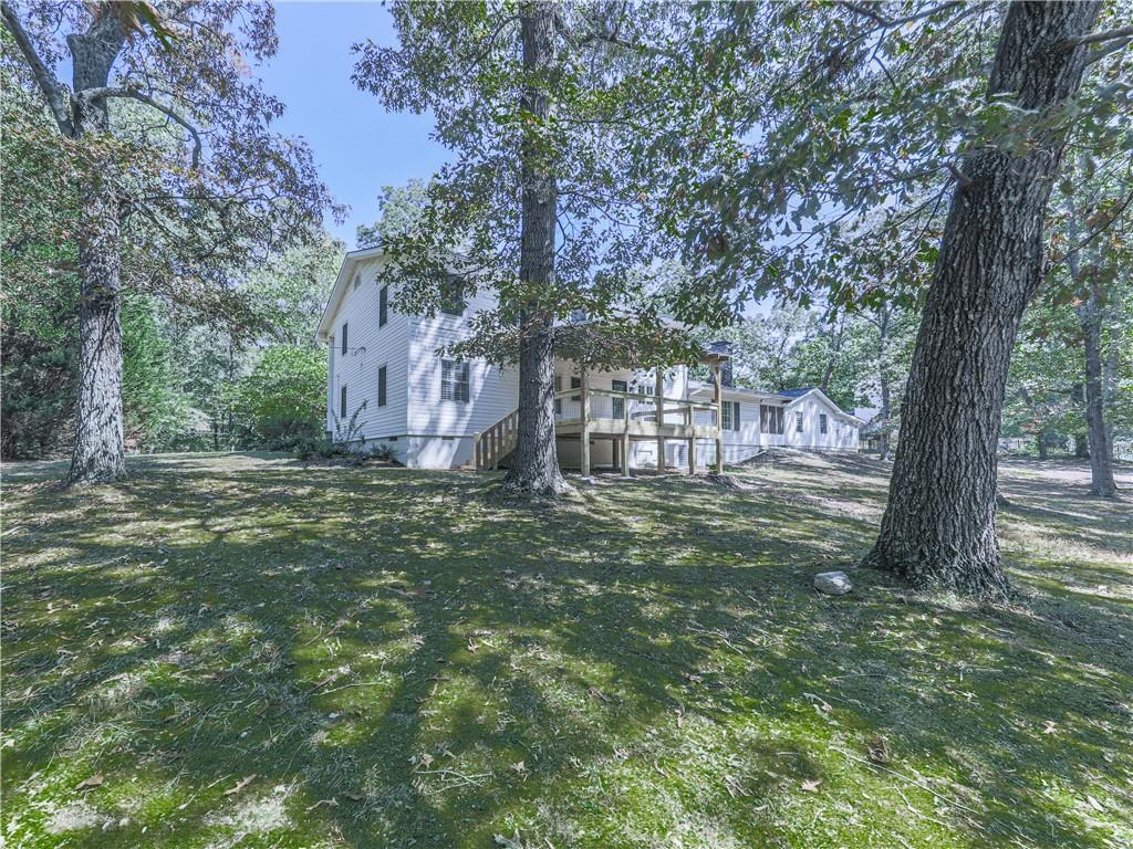 633 Butterworth Road Canton, GA 30114 - Photo 45 of 55 a view of a yard with a tree