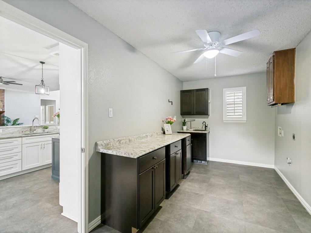 601 Mustang Ridge Drive Murphy, TX 75094 - Photo 10 of 30 Middle cabinet can slide to either side making room for a beverage frig or other use.