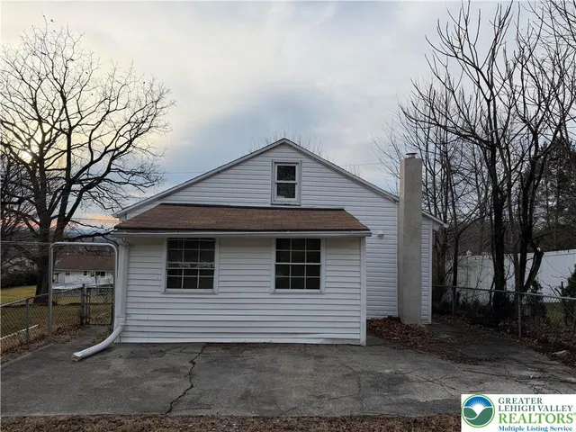 a front view of a house with garage