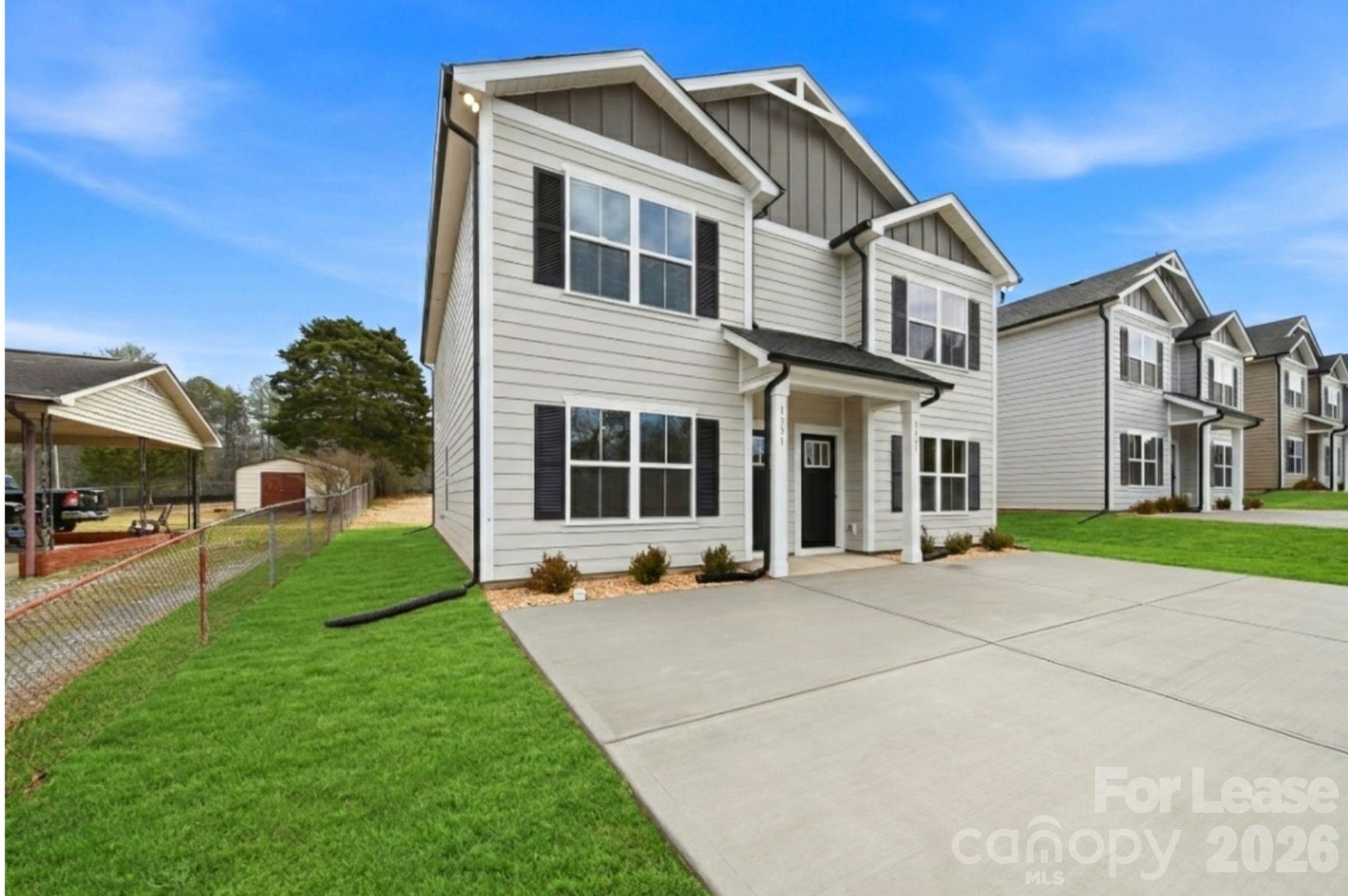 1331 33rd Street Southeast Conover, NC 28613 - Photo 5 of 15 a front view of a house with a yard and garage