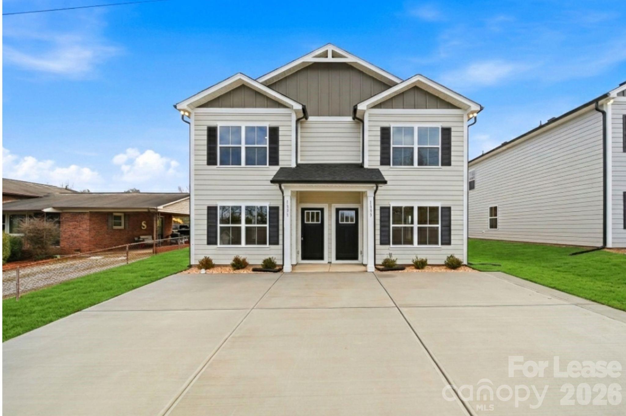 1331 33rd Street Southeast Conover, NC 28613 - Photo 6 of 15 a front view of a house with a yard and potted plants
