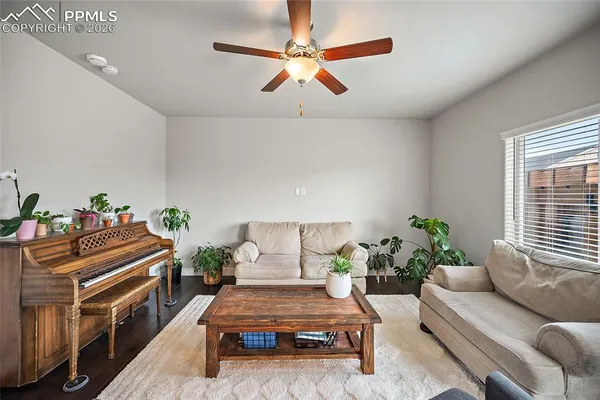 a bathroom with a granite countertop sink mirror vanity and toilet