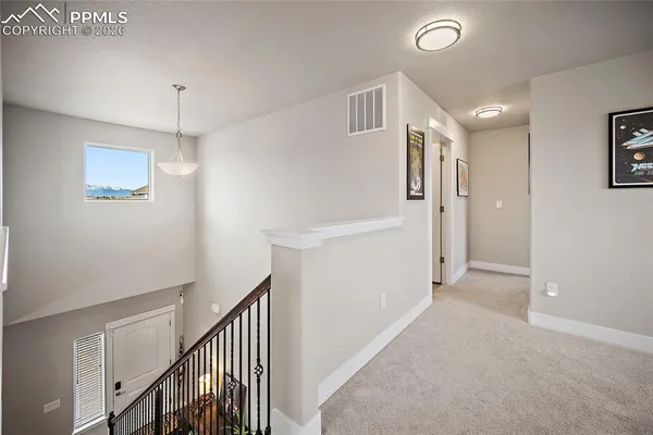 a bedroom with a bed and a ceiling fan