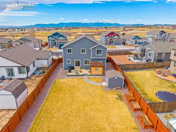 an aerial view of residential house with outdoor space