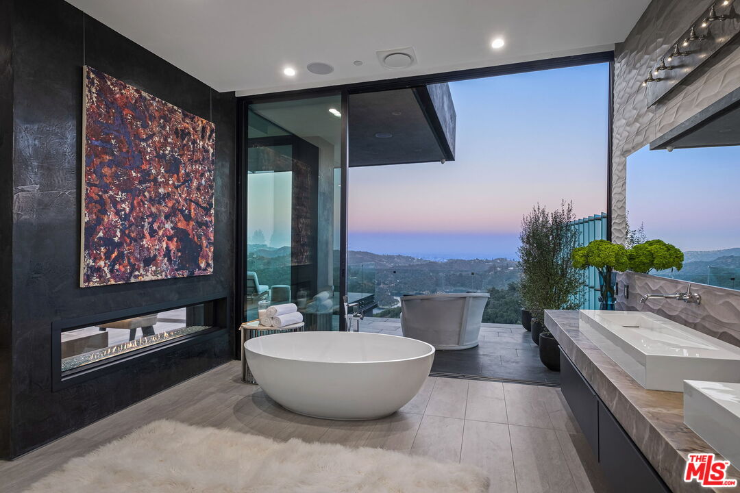 2304 Donella Circle Los Angeles, CA 90077 - Photo 19 of 35 a room with a large window and table