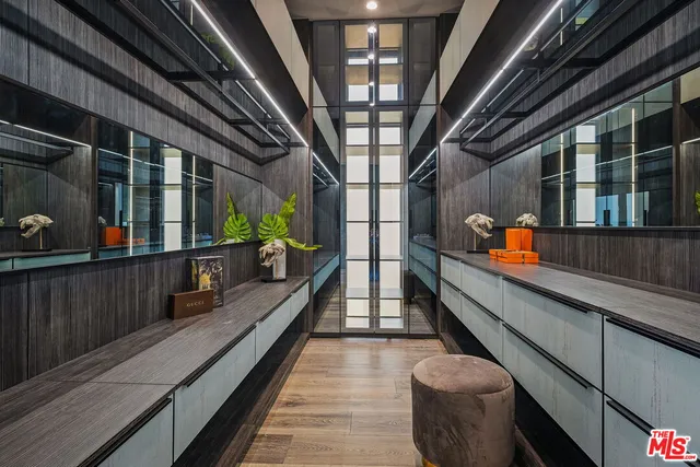 a bedroom with a bed and a potted plant