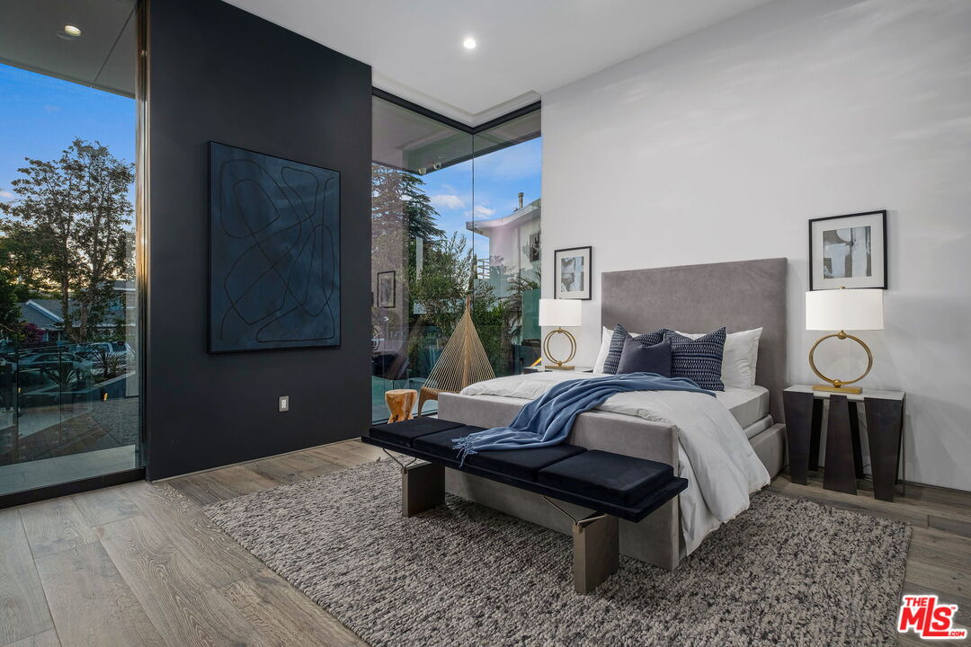 2304 Donella Circle Los Angeles, CA 90077 - Photo 22 of 35 a bedroom with a bed and a potted plant