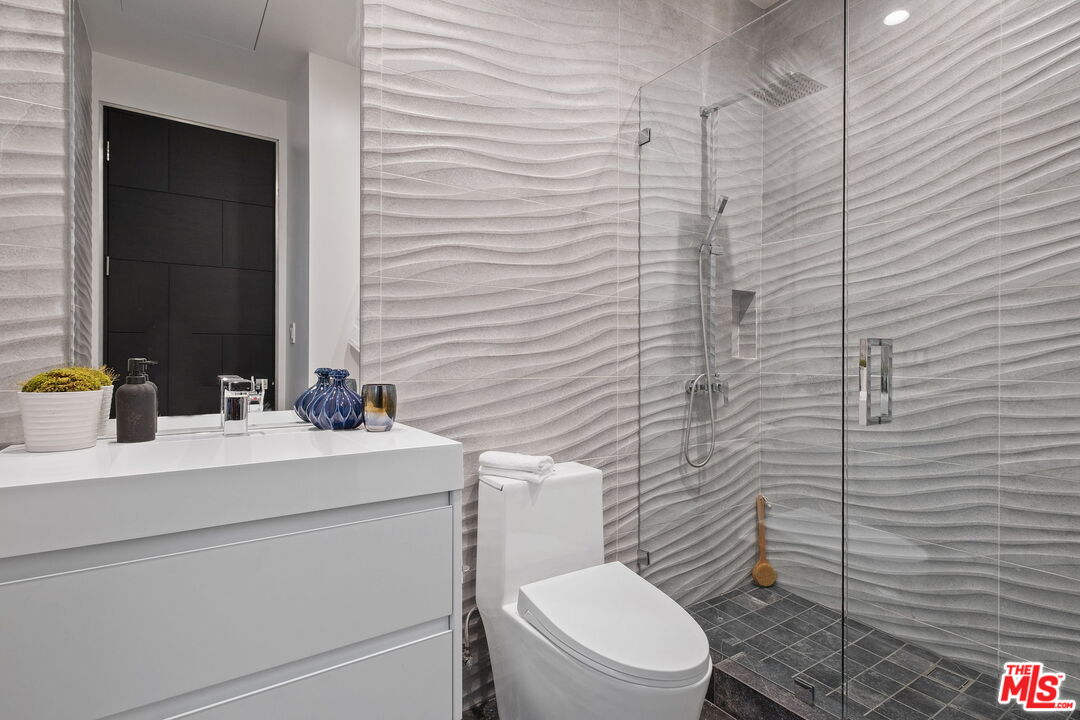 2304 Donella Circle Los Angeles, CA 90077 - Photo 23 of 35 a bathroom with a toilet sink and mirror