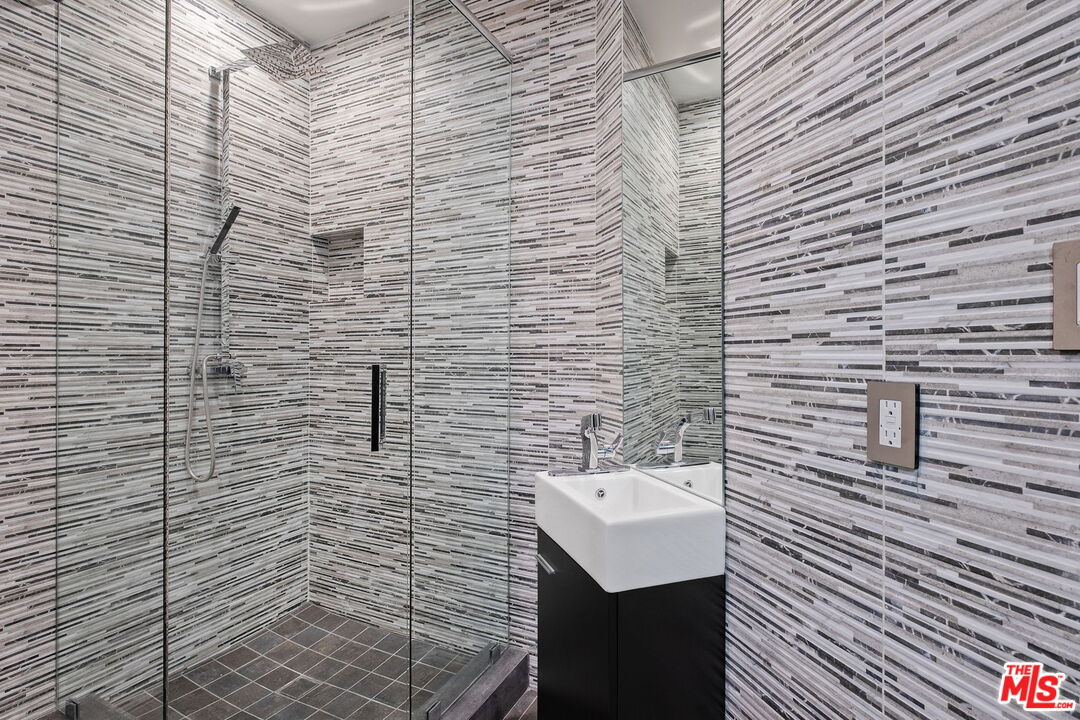 2304 Donella Circle Los Angeles, CA 90077 - Photo 25 of 35 a bathroom with a sink and a shower