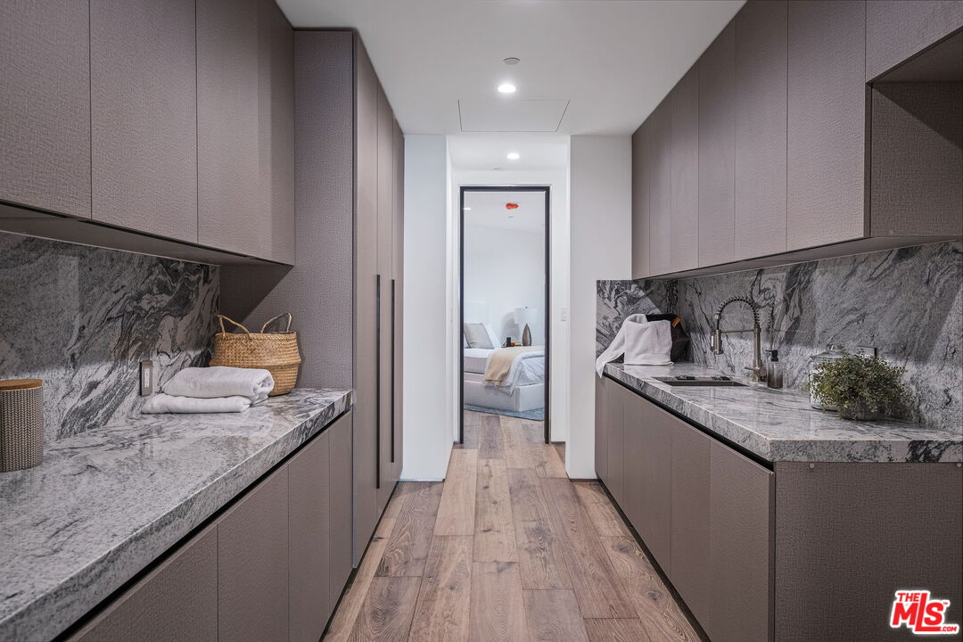 2304 Donella Circle Los Angeles, CA 90077 - Photo 29 of 35 a kitchen with stainless steel appliances granite countertop a sink and stove