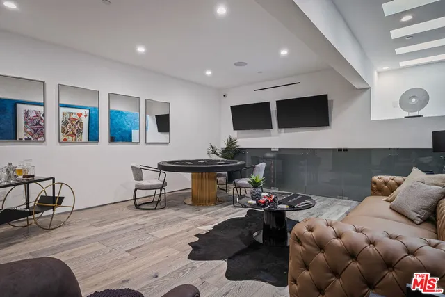a view of a patio with table and chairs and potted plants