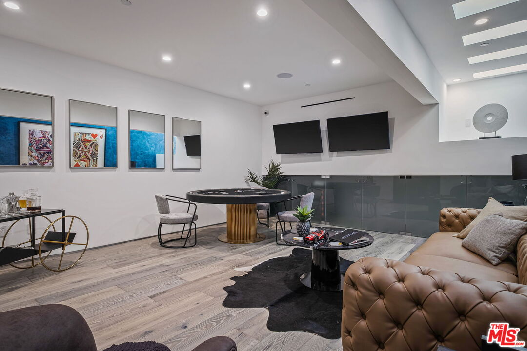 2304 Donella Circle Los Angeles, CA 90077 - Photo 31 of 35 a living room with furniture and a flat screen tv