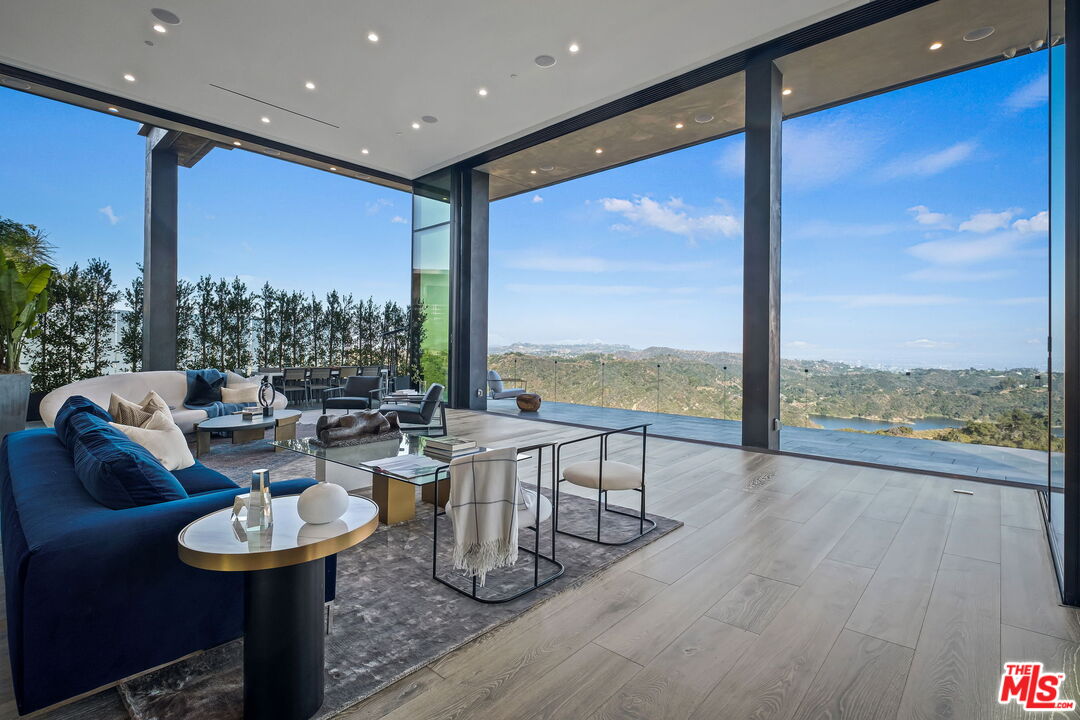 2304 Donella Circle Los Angeles, CA 90077 - Photo 6 of 35 a living room with couches and a large window with garden view