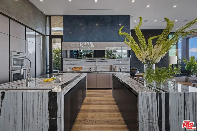 a kitchen with stainless steel appliances granite countertop lots of counter top space