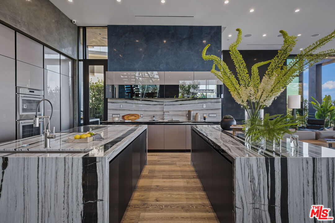 2304 Donella Circle Los Angeles, CA 90077 - Photo 7 of 35 a kitchen with stainless steel appliances granite countertop lots of counter top space