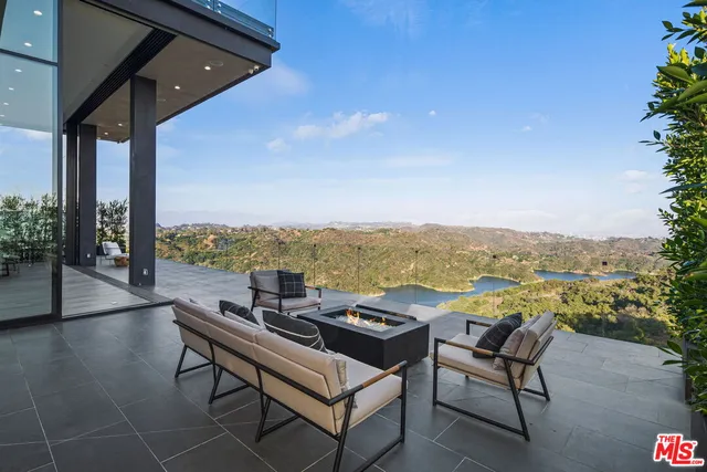 a view of a terrace with furniture and garden view