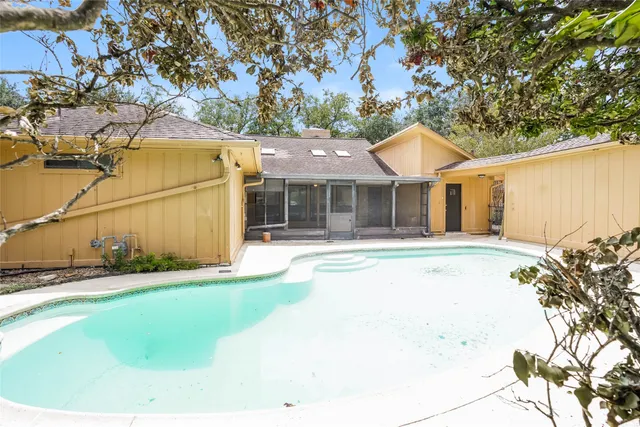 a house with a yard and a large tree