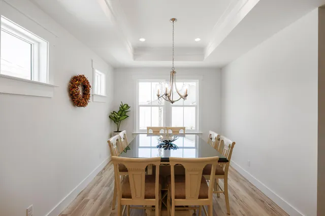 a dining room with furniture and window