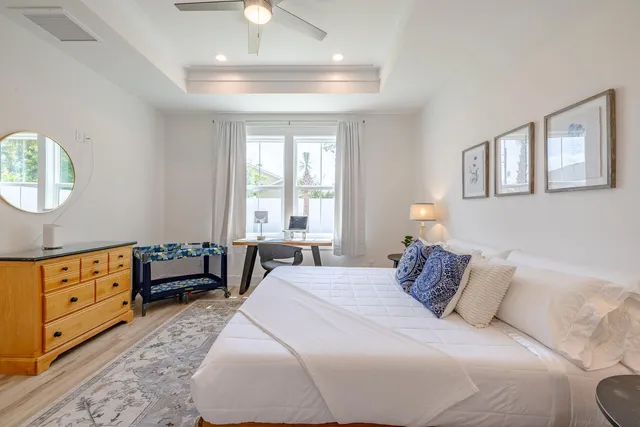 a bedroom with a bed and a dresser