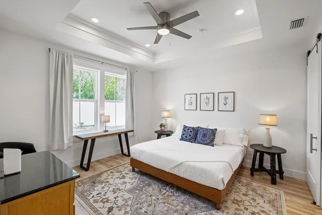 a bedroom with a bed and a table