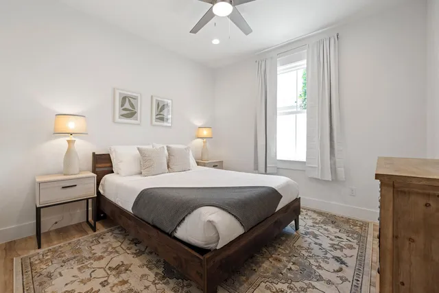 a bed room with a bed and a chandelier