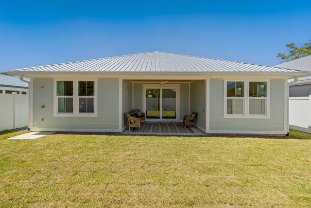 a view of a house with swimming pool in front of it