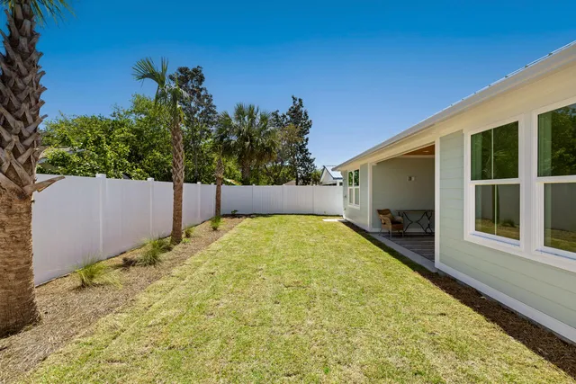 a swimming pool with some trees in the background