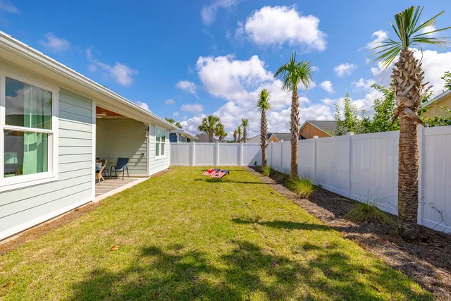 a swimming pool with wooden fence