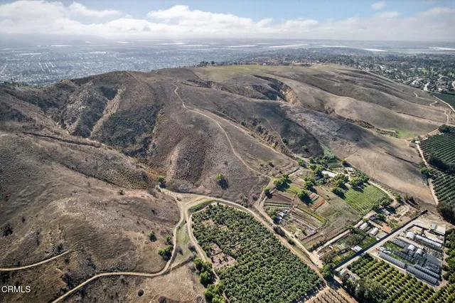 a view of a backyard of the house