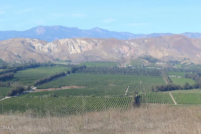 a view of mountain view with mountains in the background