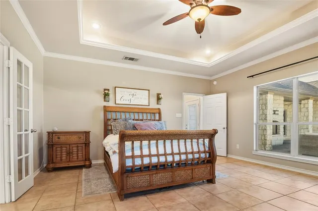 a bedroom with a bed and window