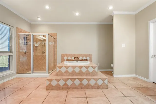 a spacious bedroom with a bed and a shower
